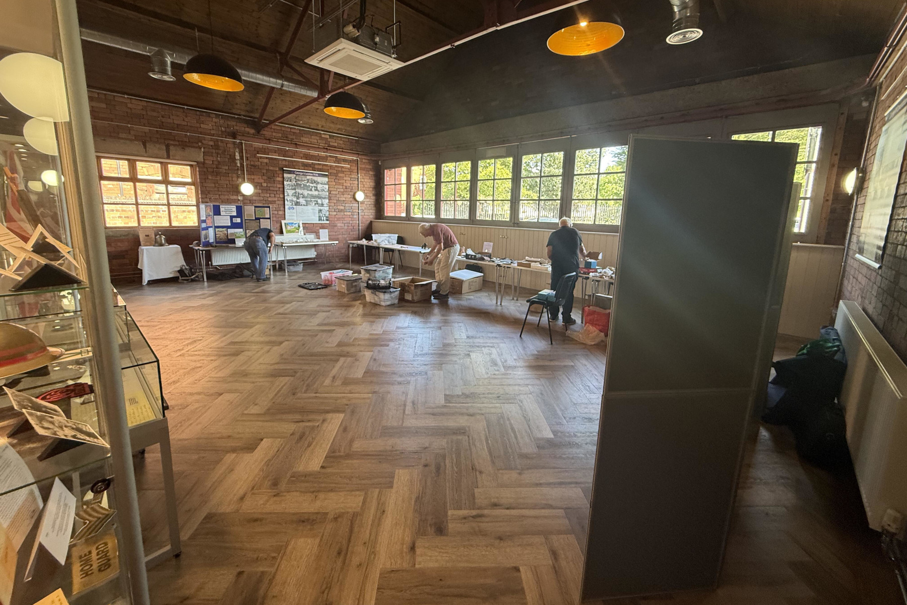 A view of the main exhibition hall at the Heritage Centre with the tables and information boards being set up