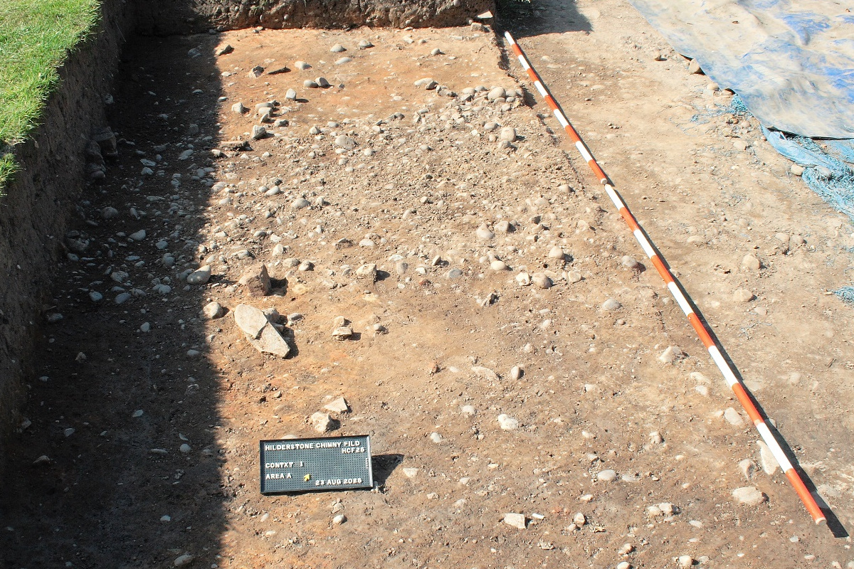 The stream bed of a small stream that appears run under the East Wing of the building towards the present stream just out of sight beyond the bushes at the top of the image
